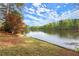 Scenic lake view showcasing a calm waterfront with lush greenery and a partly cloudy sky at 1141 Ragley Hall Ne Rd, Brookhaven, GA 30319