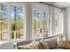 Lake view through many windows and a glass door in the living room at 1141 Ragley Hall Ne Rd, Brookhaven, GA 30319