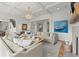 Bright living room features a decorative ceiling, light hardwood floors, and a blue boat painting at 1141 Ragley Hall Ne Rd, Brookhaven, GA 30319