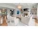 Bright living room features coffered ceilings, built-in bookshelves, fireplace, and light hardwood floors at 1141 Ragley Hall Ne Rd, Brookhaven, GA 30319