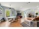 Spacious living room with hardwood floors, ample seating, and an abundance of natural light at 1141 Ragley Hall Ne Rd, Brookhaven, GA 30319