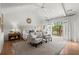 The bedroom boasts a vaulted ceiling, hardwood floors, and access to a private balcony at 1141 Ragley Hall Ne Rd, Brookhaven, GA 30319