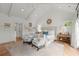 Bright main bedroom with a sitting area, French doors to a private deck, and a tray ceiling at 1141 Ragley Hall Ne Rd, Brookhaven, GA 30319