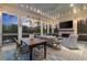 Cozy screened patio with views, a fireplace, outdoor seating, and dining area at 1141 Ragley Hall Ne Rd, Brookhaven, GA 30319