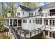 Expansive rear exterior view featuring a back deck, screened porch, and multi-level design at 1141 Ragley Hall Ne Rd, Brookhaven, GA 30319