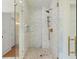 Modern glass shower featuring white subway tile and brass hardware at 1141 Ragley Hall Ne Rd, Brookhaven, GA 30319