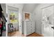 Bright walk-in closet with a storage cabinet, window, and hardwood floors at 1141 Ragley Hall Ne Rd, Brookhaven, GA 30319
