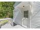 White back door with a porch and handrail for easy access to the outdoor area at 1050 N Carter Rd, Decatur, GA 30030