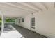 Covered back porch with white support pillars and a view of the backyard at 1050 N Carter Rd, Decatur, GA 30030