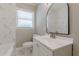 Clean bathroom featuring marble-like tile, a new vanity, and modern fixtures at 1050 N Carter Rd, Decatur, GA 30030