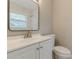 Bright bathroom features a modern vanity with a large mirror and stylish white marble-look shower tiles at 1050 N Carter Rd, Decatur, GA 30030