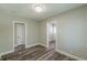 Cozy bedroom with hardwood floors, fresh paint, and ample natural light for a comfortable retreat at 1050 N Carter Rd, Decatur, GA 30030