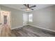 Bedroom featuring wood-look floors, fresh paint, and natural light from a window at 1050 N Carter Rd, Decatur, GA 30030
