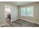 Charming dining area featuring hardwood floors, neutral paint, and a view into the updated kitchen at 1050 N Carter Rd, Decatur, GA 30030