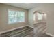 Bright dining room with hardwood floors, arched doorway, and natural light creates a comfortable dining space at 1050 N Carter Rd, Decatur, GA 30030