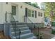 Charming home exterior with updated siding, decorative door, and well-maintained landscaping at 1050 N Carter Rd, Decatur, GA 30030