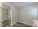 Open-concept living room with wood-look floors and fresh paint, bathed in natural light at 1050 N Carter Rd, Decatur, GA 30030