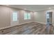 Inviting living room featuring stylish flooring, fresh neutral paint and a charming decorative front door at 1050 N Carter Rd, Decatur, GA 30030