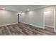 Spacious living room with new hardwood flooring and fresh paint, offering a bright and modern feel at 1050 N Carter Rd, Decatur, GA 30030
