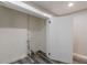 Interior storage space showing laminate flooring and an open white door at 1050 N Carter Rd, Decatur, GA 30030