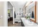 Bright en-suite bathroom with double sinks and a glass-enclosed shower at 164 Chickasaw Ln, Austell, GA 30168