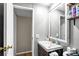 Bathroom featuring wood-style vanity, vessel sink, medicine cabinet, and adjacent toilet area at 164 Chickasaw Ln, Austell, GA 30168