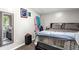 Cozy bedroom featuring a Queen sized bed and adjacent closet area with mirror at 164 Chickasaw Ln, Austell, GA 30168