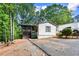 Charming home with a cozy screened porch nestled among mature trees at 164 Chickasaw Ln, Austell, GA 30168