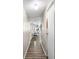 Bright hallway features laminate floors leading to kitchen with ample light and open design at 164 Chickasaw Ln, Austell, GA 30168