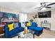 Comfortable living room featuring a large sectional and ceiling fan at 164 Chickasaw Ln, Austell, GA 30168