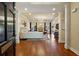 Spacious living room featuring hardwood floors, a fireplace, and ample natural light at 225 Wexford Overlook Dr, Roswell, GA 30075