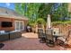 Charming patio with brick flooring, outdoor seating, grill, and privacy fence, perfect for entertaining and relaxing outdoors at 225 Wexford Overlook Dr, Roswell, GA 30075