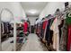Spacious walk-in closet with ample shelving, hanging rods, and plenty of storage space at 225 Wexford Overlook Dr, Roswell, GA 30075