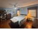 Inviting bedroom with wood floors, ceiling fan, and cozy armchair at 2932 Highway 20 Se, Conyers, GA 30013