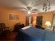 Bright bedroom with hardwood floors, a ceiling fan, and classic decor at 2932 Highway 20 Se, Conyers, GA 30013