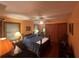 Bedroom with hardwood floors, a ceiling fan, and a cozy sitting chair at 2932 Highway 20 Se, Conyers, GA 30013