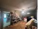 Untidy bedroom with lots of storage shelves and vintage armchairs at 2932 Highway 20 Se, Conyers, GA 30013
