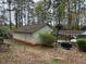 Detached garage with a carport and long driveway offer plenty of parking and storage at 2932 Highway 20 Se, Conyers, GA 30013