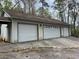 Spacious three-car garage with white doors offering ample parking and storage space at 2932 Highway 20 Se, Conyers, GA 30013