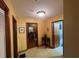 Inviting hallway with warm lighting, neutral paint, and doorways leading to other rooms in the home at 2932 Highway 20 Se, Conyers, GA 30013