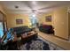 Open living room featuring an area rug, couches, and natural lighting at 2932 Highway 20 Se, Conyers, GA 30013