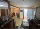 Spacious living space featuring wooden dining table, a kitchen and access to another living space at 2932 Highway 20 Se, Conyers, GA 30013