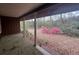 View from covered porch of landscaped yard with azaleas at 2932 Highway 20 Se, Conyers, GA 30013