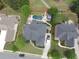 Aerial view of home with a backyard oasis including pool, patio, and lush landscaping at 3855 Greenside Ct, Dacula, GA 30019