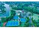 Resort style community with tennis courts, lake, clubhouse, playground, and green landscaping at 3855 Greenside Ct, Dacula, GA 30019