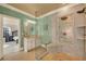 Beautiful bathroom with a glass-enclosed shower with rain shower head and vanity at 3855 Greenside Ct, Dacula, GA 30019