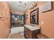 Bathroom with granite vanity and colorful tile shower at 3855 Greenside Ct, Dacula, GA 30019
