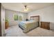 Bedroom with neutral walls, carpeted floors, and a large window with natural light at 3855 Greenside Ct, Dacula, GA 30019