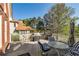 Outdoor deck features a built in grill, seating and wooded backdrop for outdoor entertaining at 3855 Greenside Ct, Dacula, GA 30019