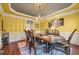 Formal dining room with chandelier and decorative ceiling at 3855 Greenside Ct, Dacula, GA 30019